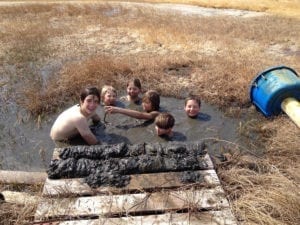 A Handcrafted Education: Fun in the warm mud! It looks just like coffee. 