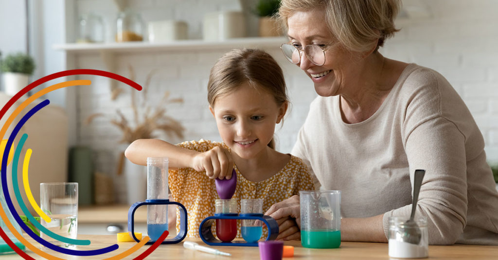 A grandmother plays with her granddaughter.