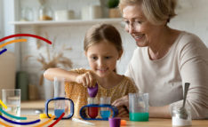 A grandmother plays with her granddaughter.