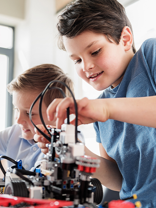 boys building a robot