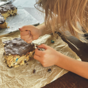 Edible Fossil Dig - Little Boy Digging Through Cookie to Find Fossils (Candy)