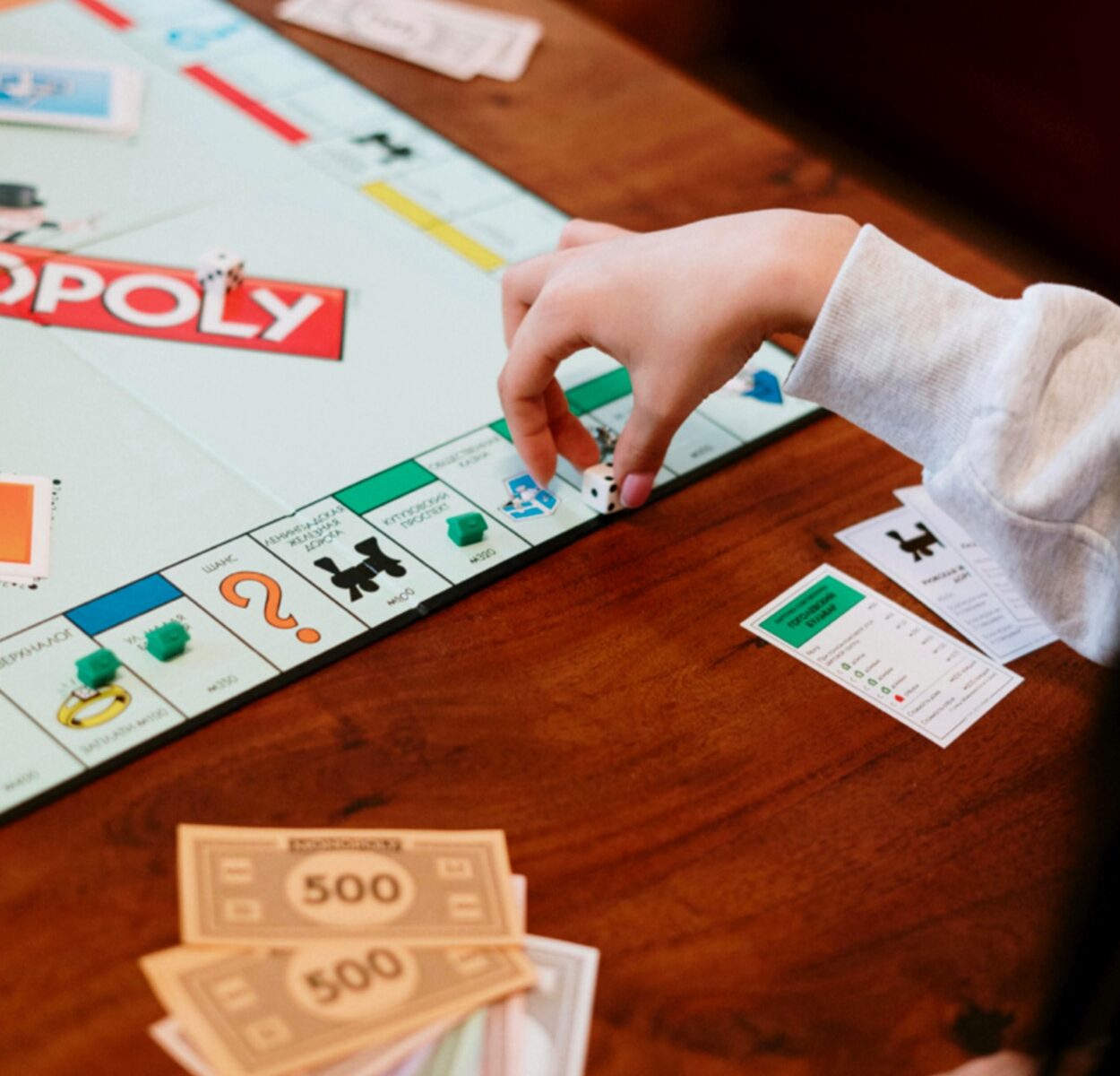 Gameschooling: Photo of someone playing monopoly