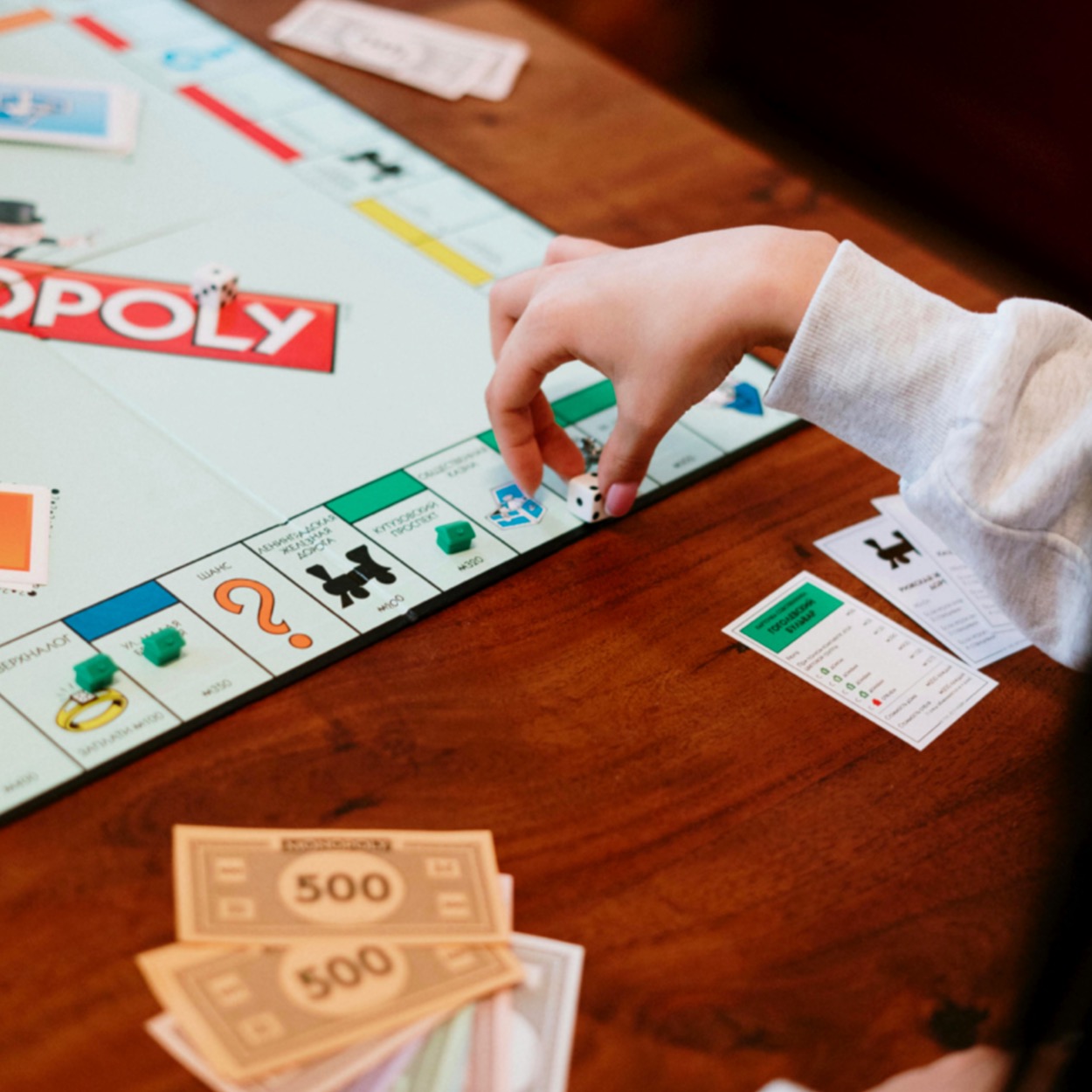 Gameschooling: Photo of someone playing monopoly