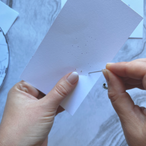 Science Teaching Methods: Poking Holes in Card Stock to Align with Star Chart for Mini Planetarium Activity