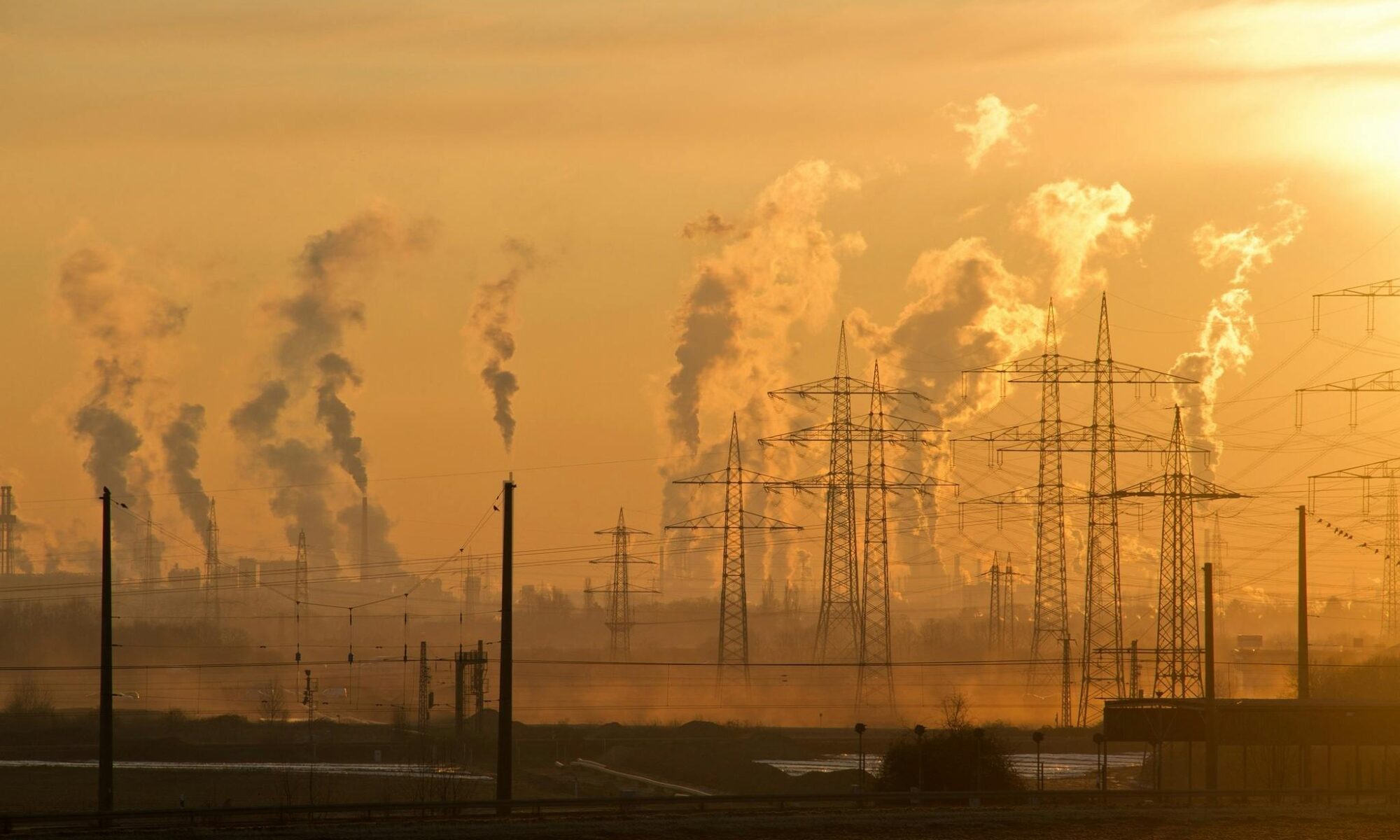 Homeschool Tips: How to Talk to Kids About Scary Science - Photo of Electric Towers During Golden Hour Highlighting Smog Coming Out of Towers