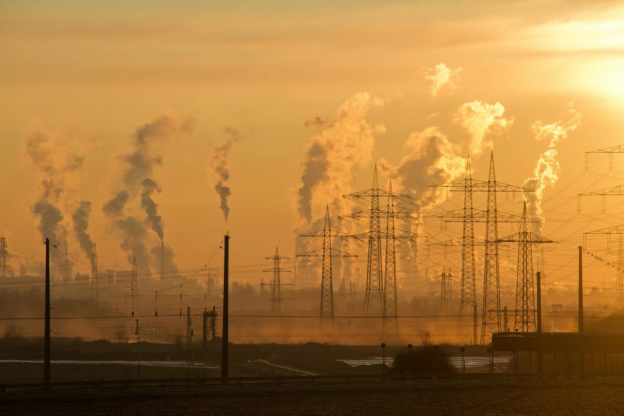 Homeschool Tips: How to Talk to Kids About Scary Science - Photo of Electric Towers During Golden Hour Highlighting Smog Coming Out of Towers